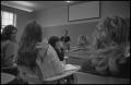 Photograph: [Students are seen during a lecture in a classroom]