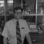 Photograph: [Man in front of lab equipment, 2]