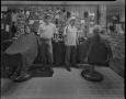 Photograph: [Barbers in a Plano barbershop]