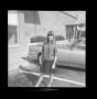 Photograph: [Photo of Pam Williams standing in front of a car]