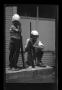 Primary view of [Byrd III and Charles Williams playing with toy guns]