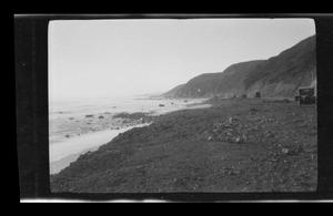 Primary view of [Model T's driving along a shoreline]