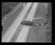 Photograph: [The YH-40 #7 flying over a freeway in Hurst, Texas]