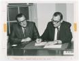 Photograph: [Two Men Reviewing Documents]