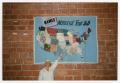 Primary view of [Worker Pointing At The Names Project National Tour 88 Quilt Map]