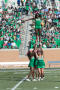 Photograph: [UNT Cheerleaders Performing Basic Extension]