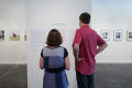 Photograph: [Couple Looking at Art from the Diane E. Williams Art Reception]