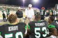 Photograph: [Mean Green Coach Talking with his Team]