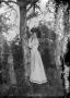 Primary view of [Outdoor Portrait of Woman Against Tree]