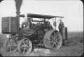 Postcard: [Steam powered tractor with farmer]