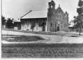 Primary view of [Holy Rosary Catholic Church, a stucco building]