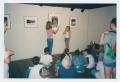 Photograph: [Children Looking at Pictures]