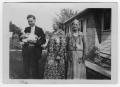 Photograph: Four Unidentified Individuals: One Infant, One Man, Two Women