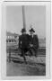 Photograph: [Wilton Cook and Lee Preston sitting on a fence]