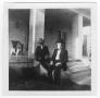 Photograph: C. A. Williams Sitting on Porch with Grandson, C. A. Williams