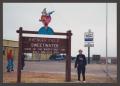 Photograph: [Woman and Avenger Field Sign]