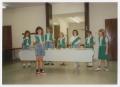 Photograph: [Girl Scouts During a Ceremony]