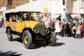 Photograph: [Yellow Antique Car at Parade]