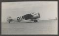 Photograph: [WWII Plane on Airfield]