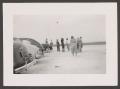 Photograph: [People and Cars on Airfield]
