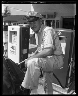 Primary view of object titled '"Pete" working at his Service Station'.