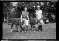 Primary view of [Two Boys and Cattle During Cleveland Dairy Day]