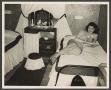 Photograph: [Woman Lying on a Bed]