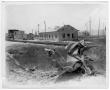Photograph: [Debris near storage tanks after the 1947 Texas City Disaster]