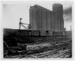 Photograph: [Train near the grain elevator after the 1947 Texas City Disaster]