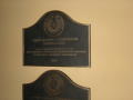 Photograph: [Two Plaques on Wall]