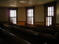 Photograph: [Benches and Windows in Courtroom]