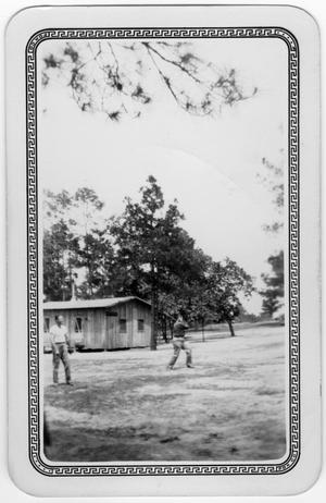 Primary view of object titled '[Two men playing baseball in a Texas Civilian Conservation Corp camp]'.