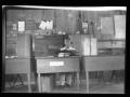 Primary view of [Man sits at a desk]