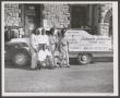 Photograph: [6 Men with Johnnie Johnson Tire Co. Truck]