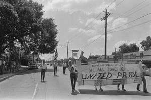 Primary view of object titled '[People Walking With Banner in Houston Gay Pride Parade]'.