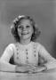 Photograph: [Young Carol with shoulder-length, curly hair, 4]