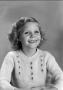 Photograph: [Young Carol with shoulder-length, curly hair, 6]