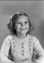 Photograph: [Young Carol with shoulder-length, curly hair, 8]