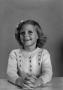 Photograph: [Young Carol with shoulder-length, curly hair, 5]