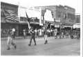 Photograph: [Parade of Boy Scouts down Third Street]