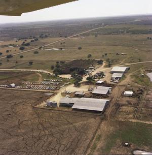 Primary view of object titled 'Aerial Photograph of Livestock Auction Barn (Callahan County, Texas)'.