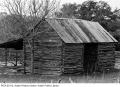 Photograph: [Exterior of log cabin at Bohl's Place]