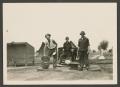 Photograph: [Three Soldiers Doing Dishes]