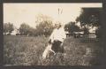 Photograph: [A Man and His Dog in a Field]