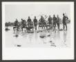 Photograph: [Group of Soldiers in a Muddy Area]