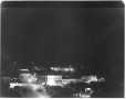 Photograph: [Rosenberg at night during World War II, Third Street and Avenue G.]