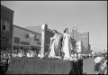 Photograph: [Two Ladies on a Float at M.U. Homecoming Parade]