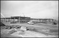 Photograph: [Cars Parked in Front of McNeil Jr. High Construction Site]