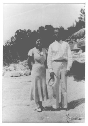Primary view of object titled '[Couple posing nearing rocks]'.