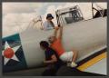 Photograph: [Gayle Snell helping Friend onto SNJ Texan]
